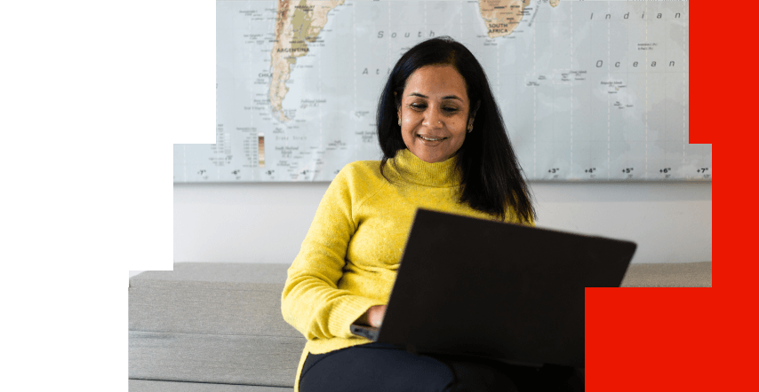 Healthcare professional using a laptop to look up biomarker testing insurance coverage information