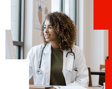 Physician using a computer to access biomarker testing and coverage resources